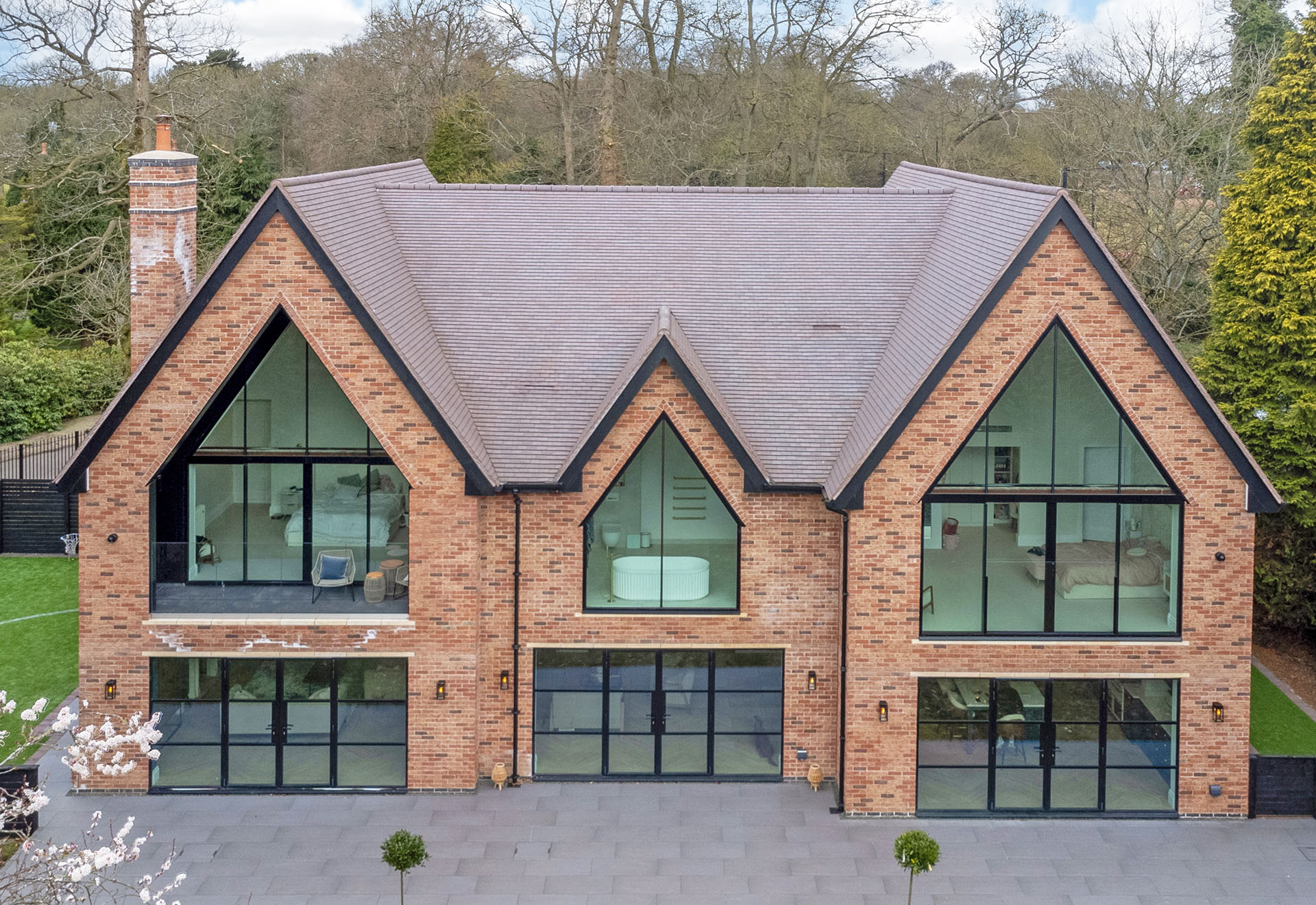 a beautiful new build house by Mercia Design Build with dark heather tiles